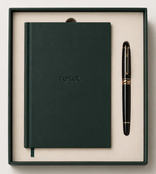 The forest-green reset. journal, with its name on the cover